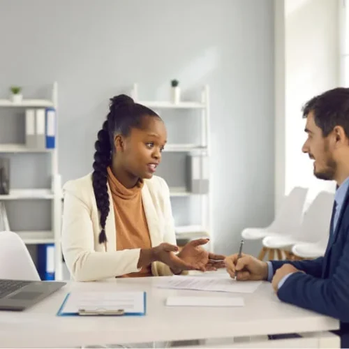 A female coach coaching a student