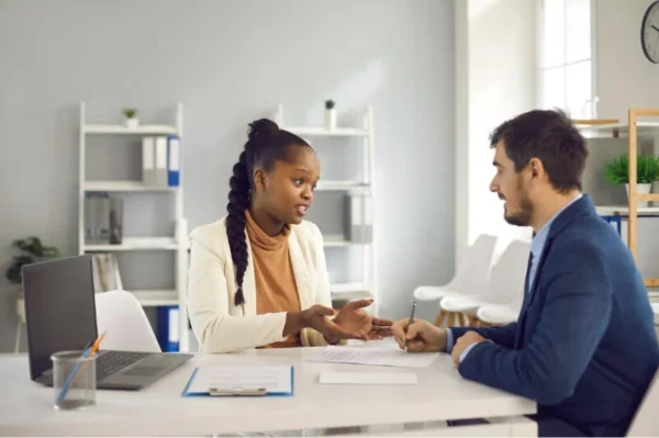 A female coach coaching a student